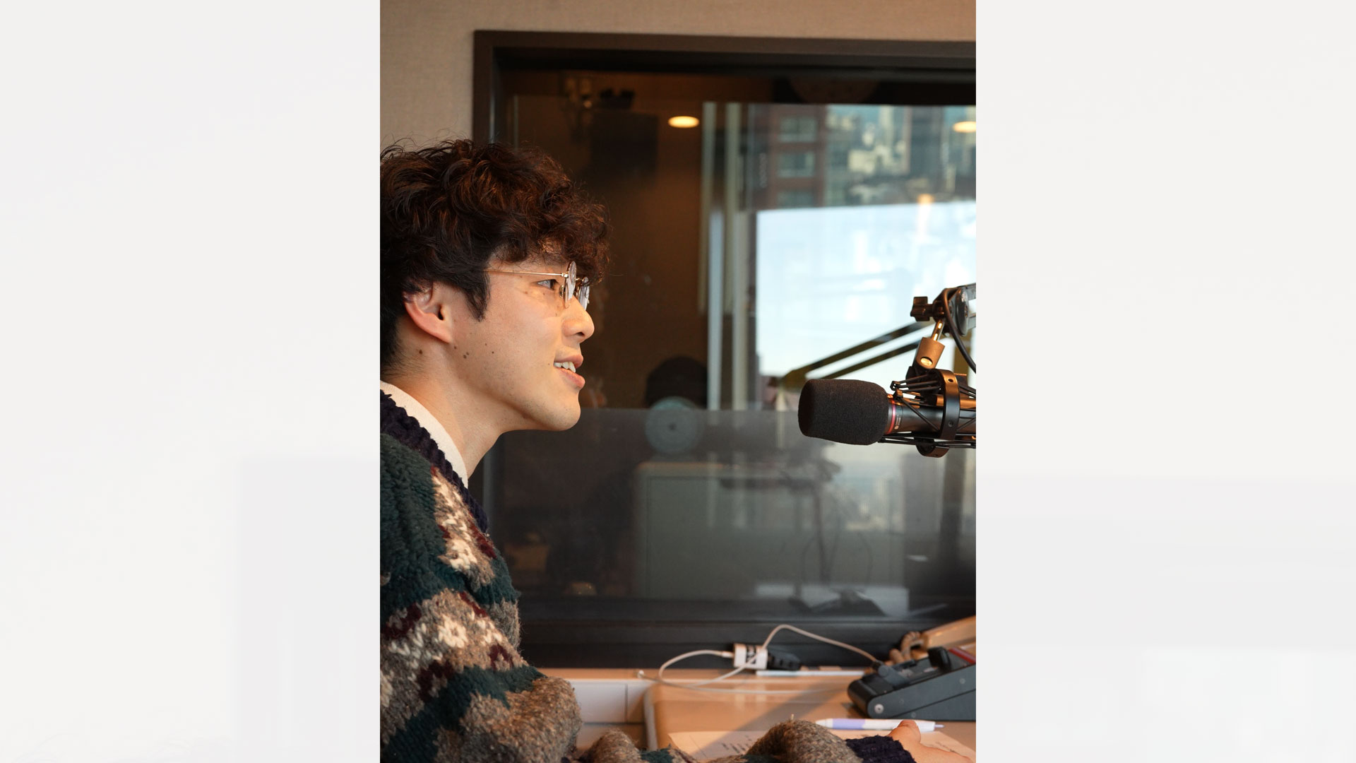 商店街のサポートについて話す石本さん